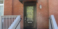 awning and outswing door
